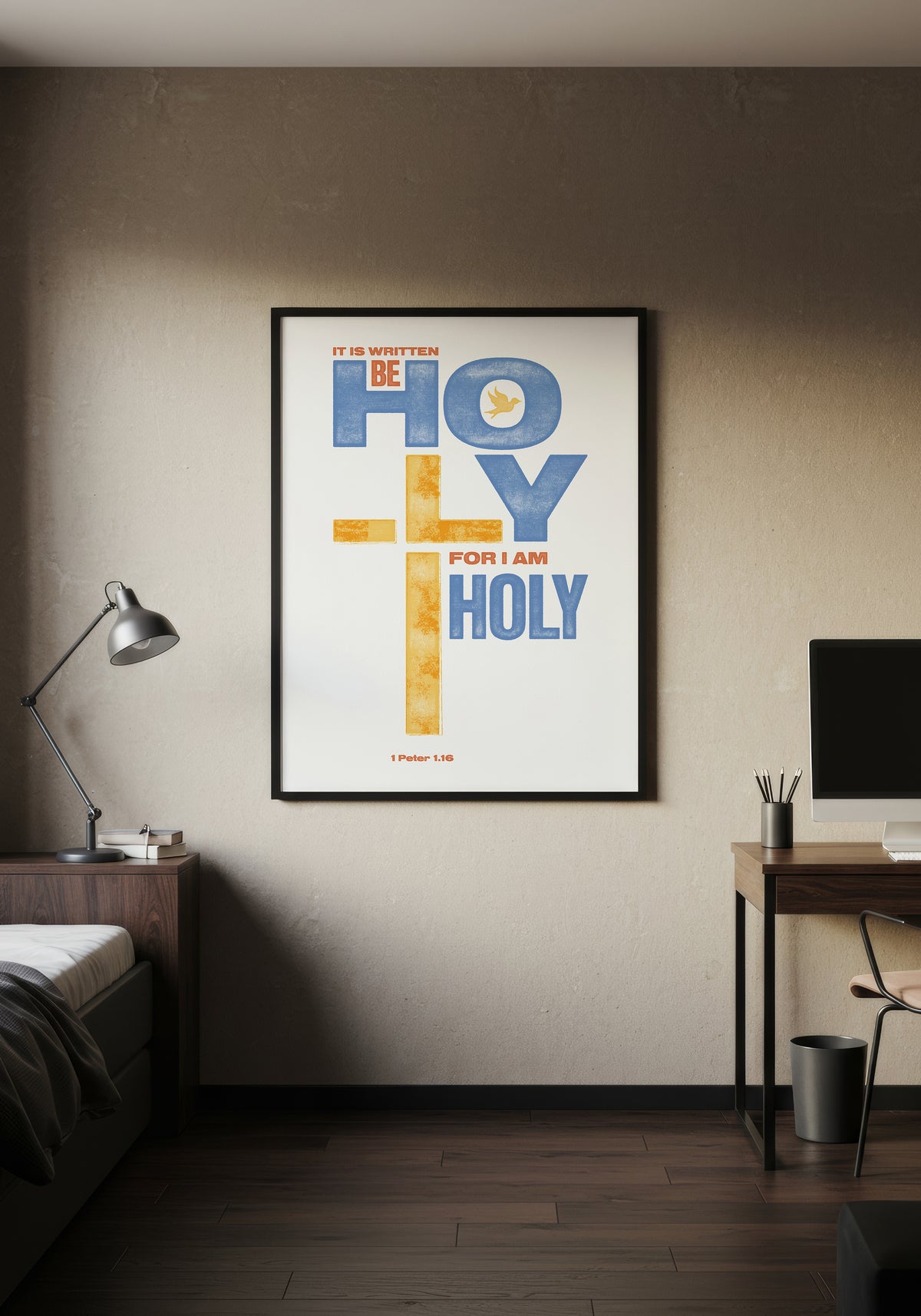 1 Peter 1:16 print in a black frame, styled as a colorful focal point in a minimalist, warmly lit bedroom.