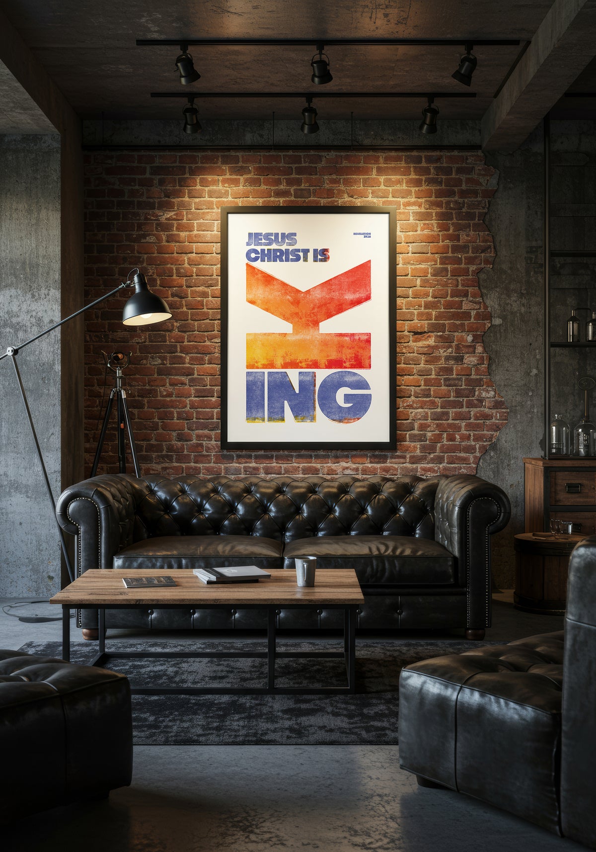 Revelation 19:16 art print in a black frame, displayed above a black leather sofa in an industrial-style living room.