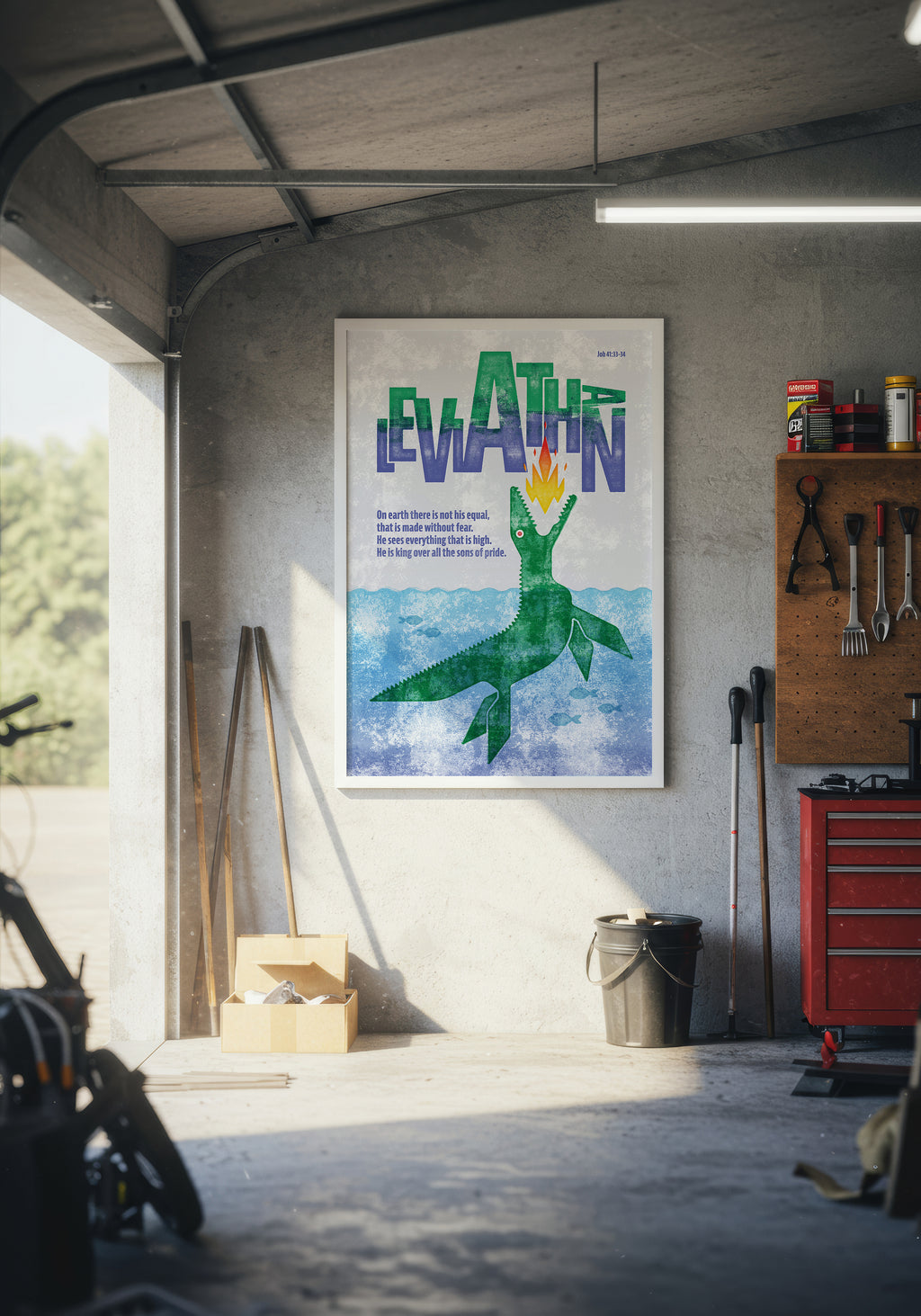 Job 41:33-34 art print in a white frame, displayed on a wall inside a modern, warmly lit garage.