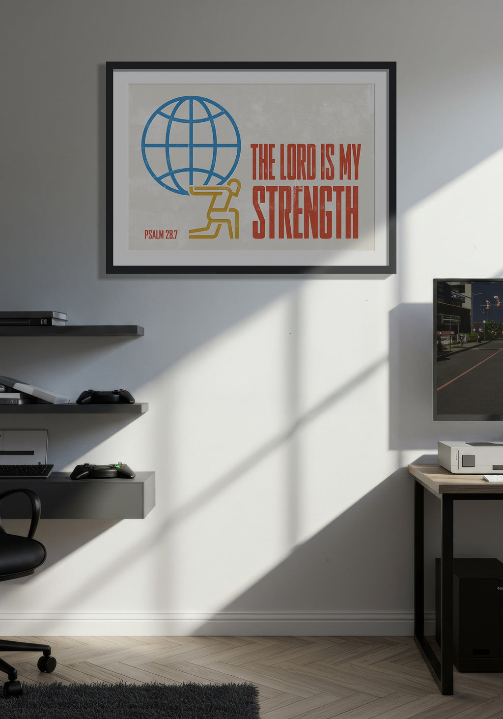 Paslm 28:7 art print in a black frame, displayed on a wall in a minimalist, warmly lit computer games room.