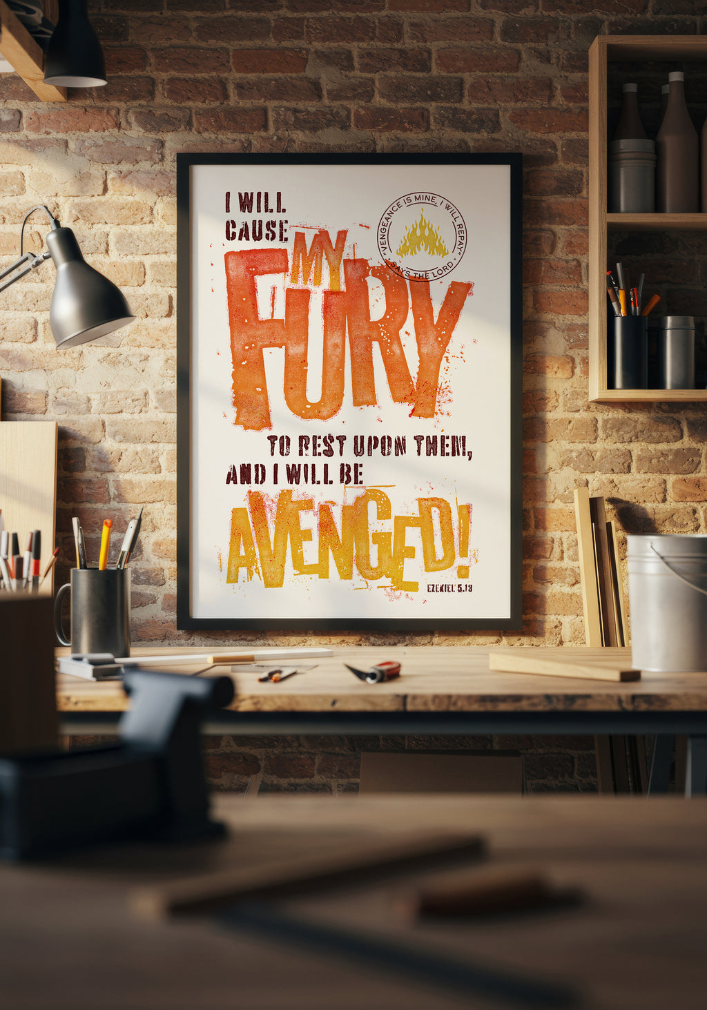 Ezekiel 5:13 art print in a black frame, displayed above a workbench in a warmly lit home workshop.