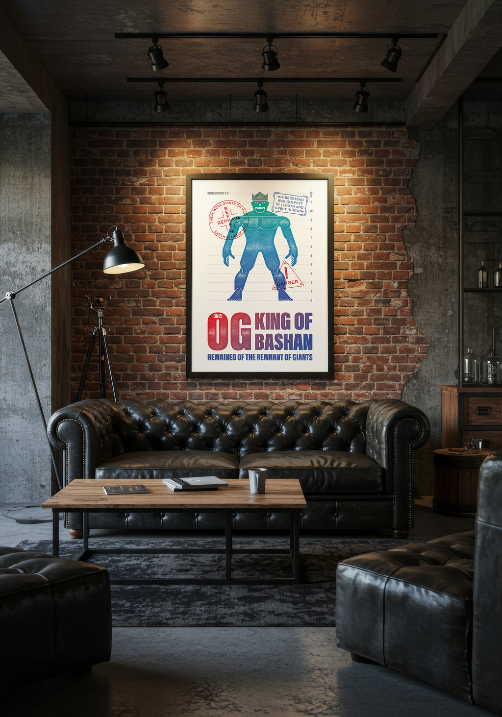 Deuteronomy 3:11 art print in a black frame, displayed above a black leather sofa in an industrial-style living room.