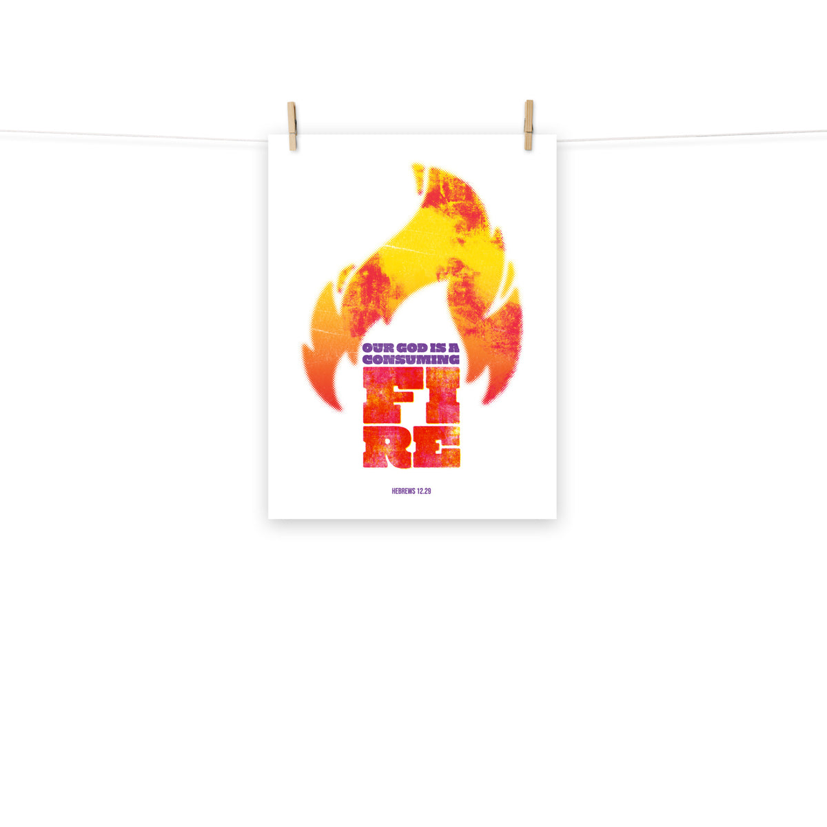 Full view of the Hebrews 12:29 poster scroll, hung by wooden clips and rope, showing the complete design.