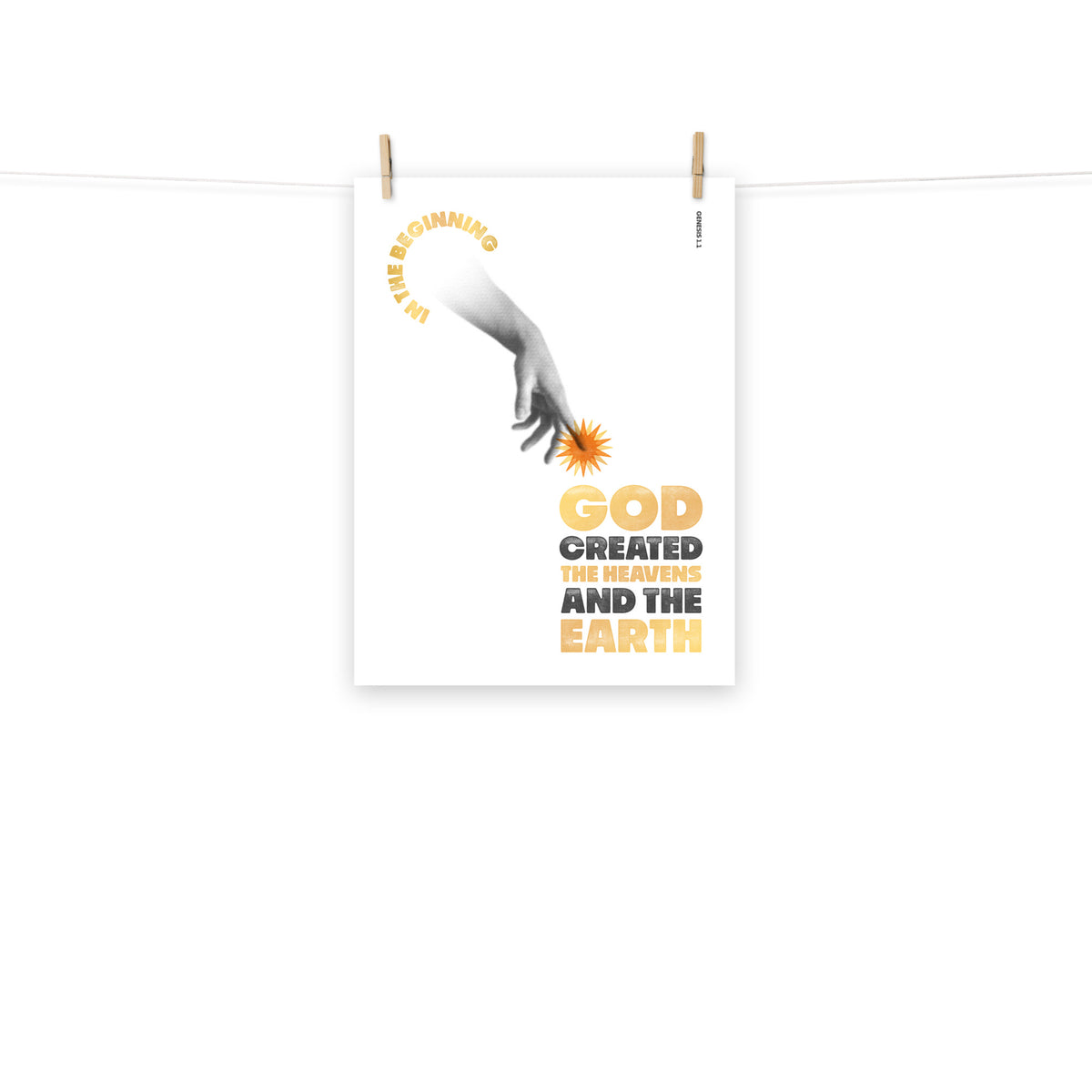 Full view of the Genesis 1:1 poster scroll, hung by wooden clips and rope, showing the complete design.