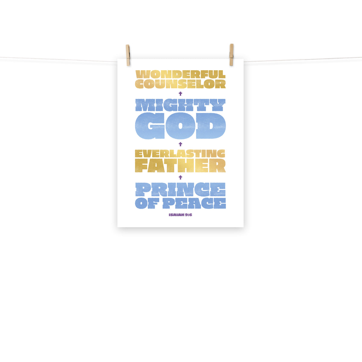 Full view of the Isaiah 9:6 poster scroll, hung by wooden clips and rope, showing the complete design.