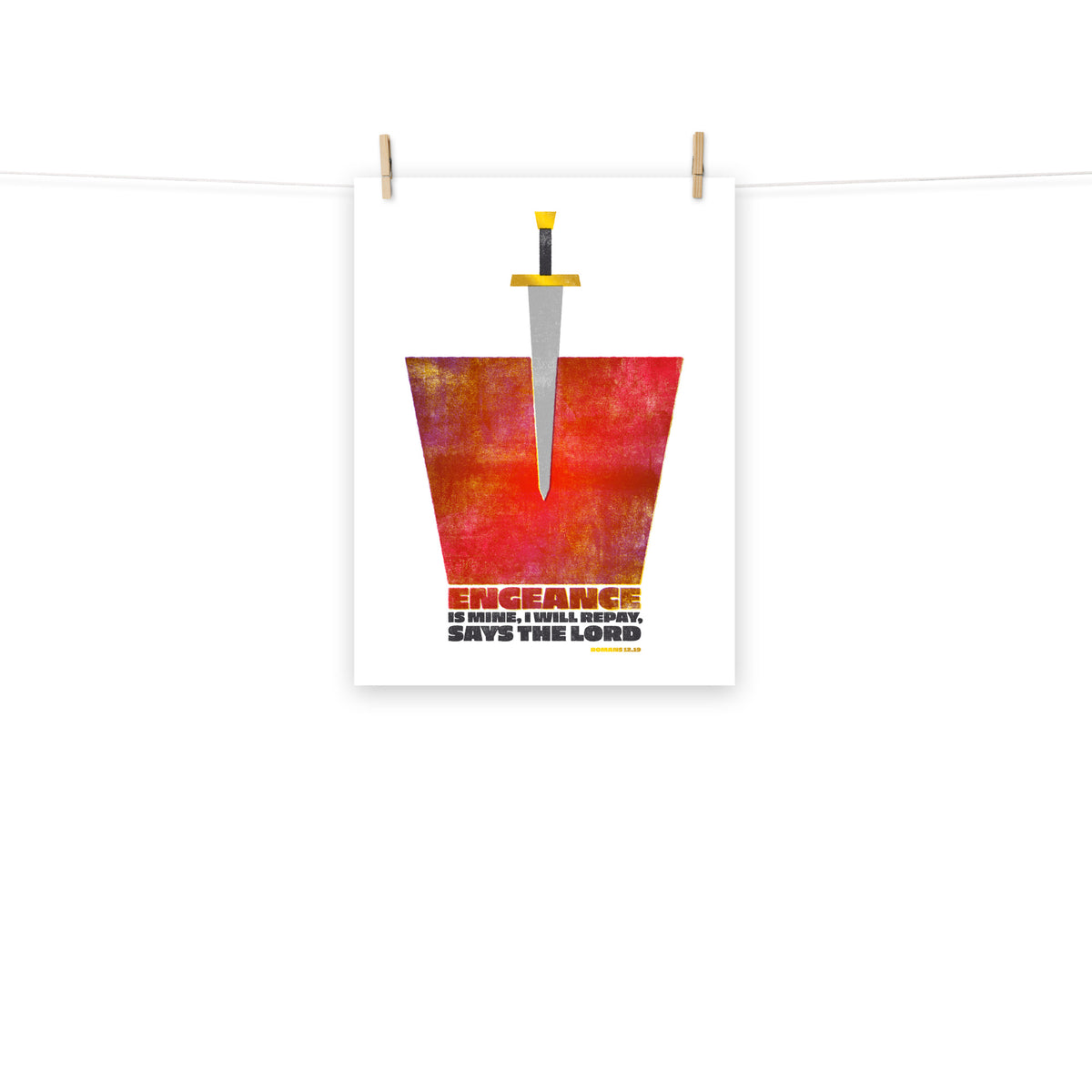 Full view of the Romans 12:19 poster scroll, hung by wooden clips and rope, showing the complete design.