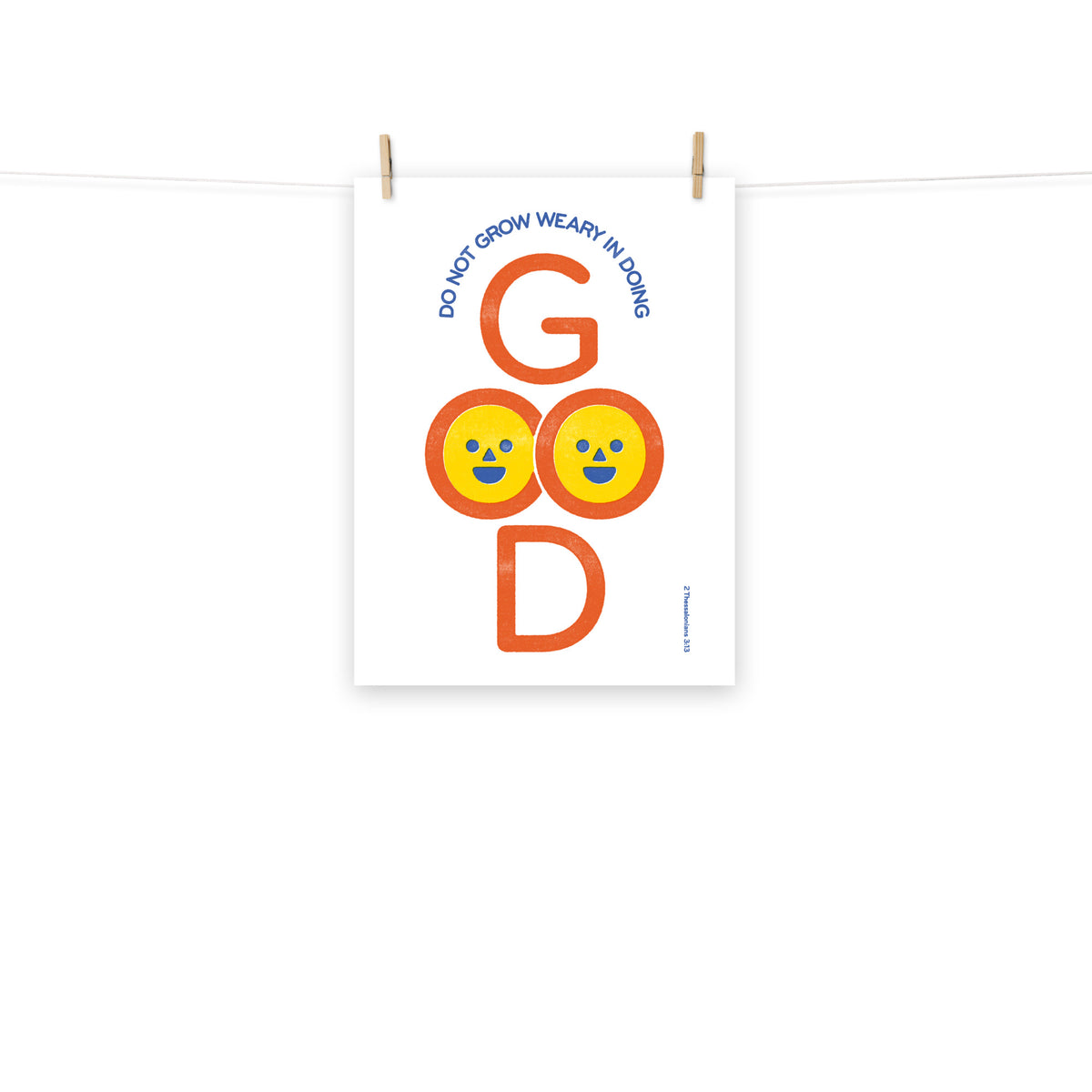 Full view of the 2 Thessalonians 3:13 poster scroll, hung by wooden clips and rope, showing the complete design.