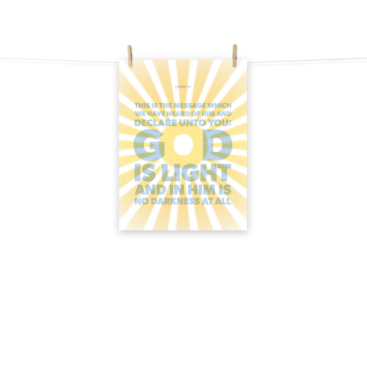 Full view of the 1 John 1:5 poster scroll, hung by wooden clips and rope, showing the complete design.