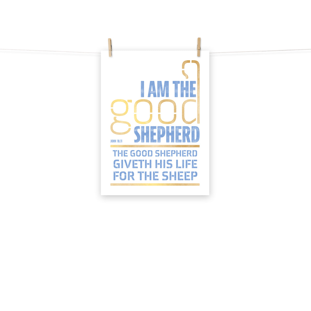Full view of the John 10:11 poster scroll, hung by wooden clips and rope, showing the complete design.