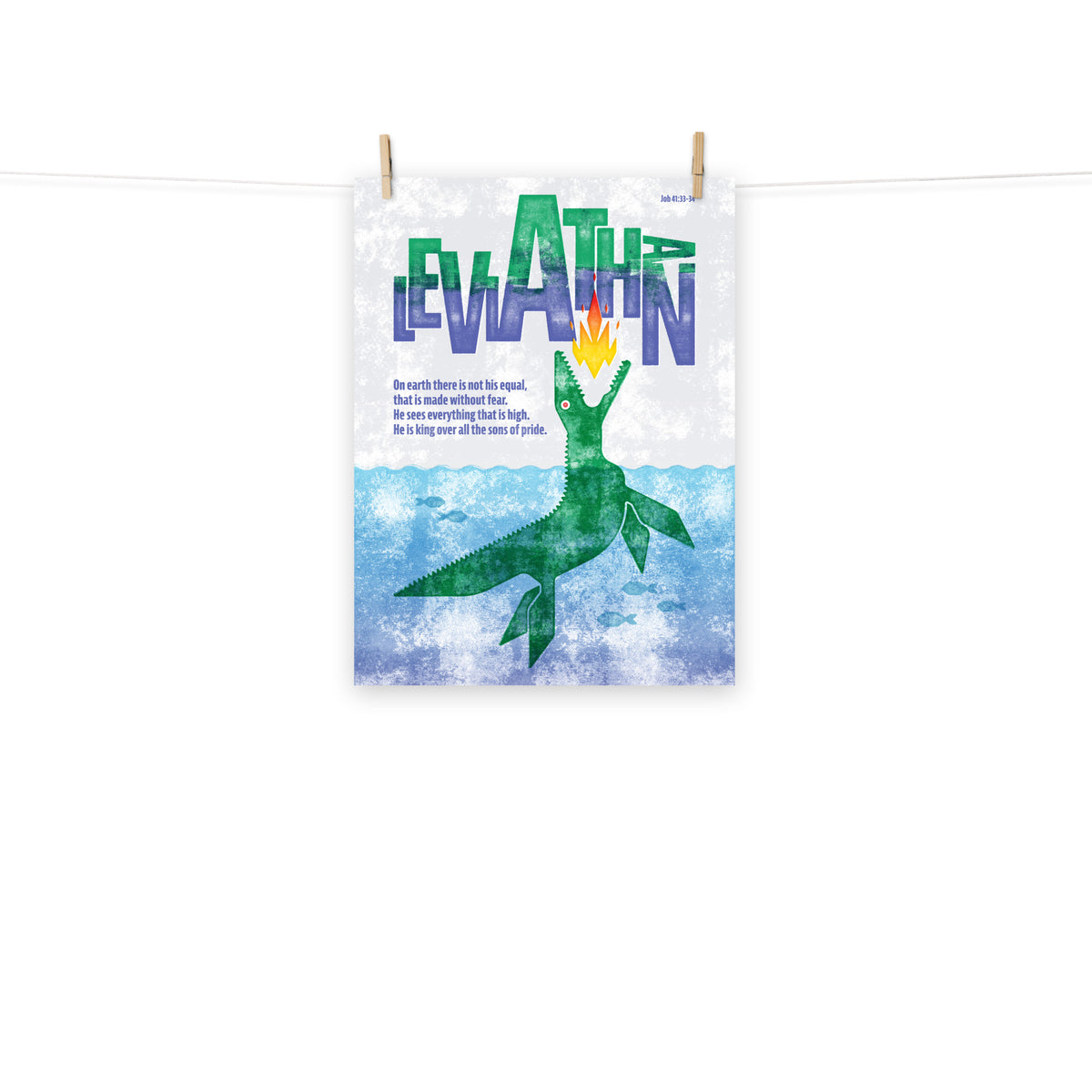 Full view of the Job 41:33-34 poster scroll, hung by wooden clips and rope, showing the complete design.
