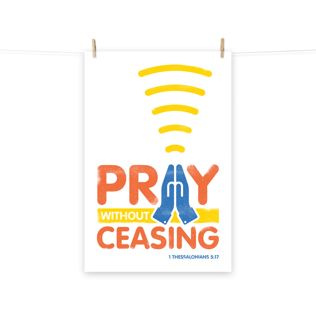 Full view of the 1 Thessalonians 5:17 poster scroll, hung by wooden clips and rope, showing the complete design.