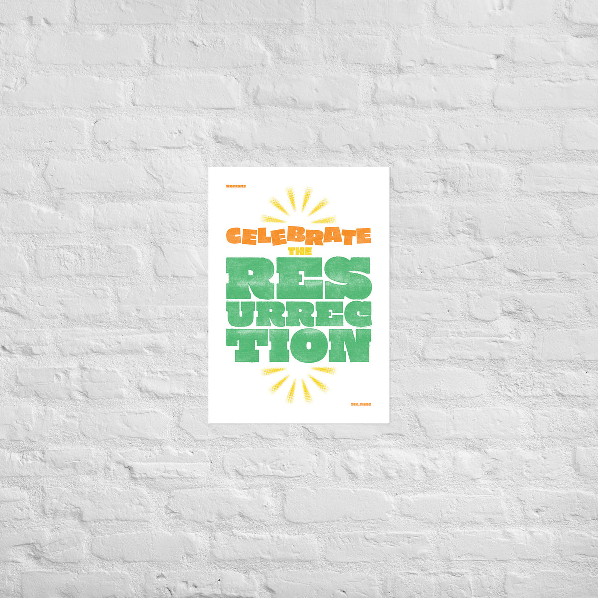 Romans 6:9 print mounted directly on a white brick wall for a frameless, modern look.