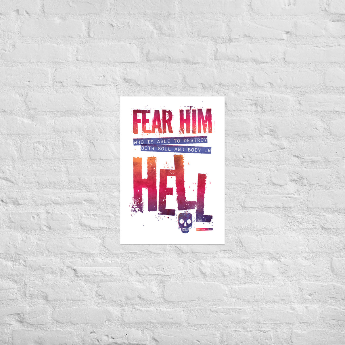 Matthew 10:28 print mounted directly on a white brick wall for a frameless, modern look.
