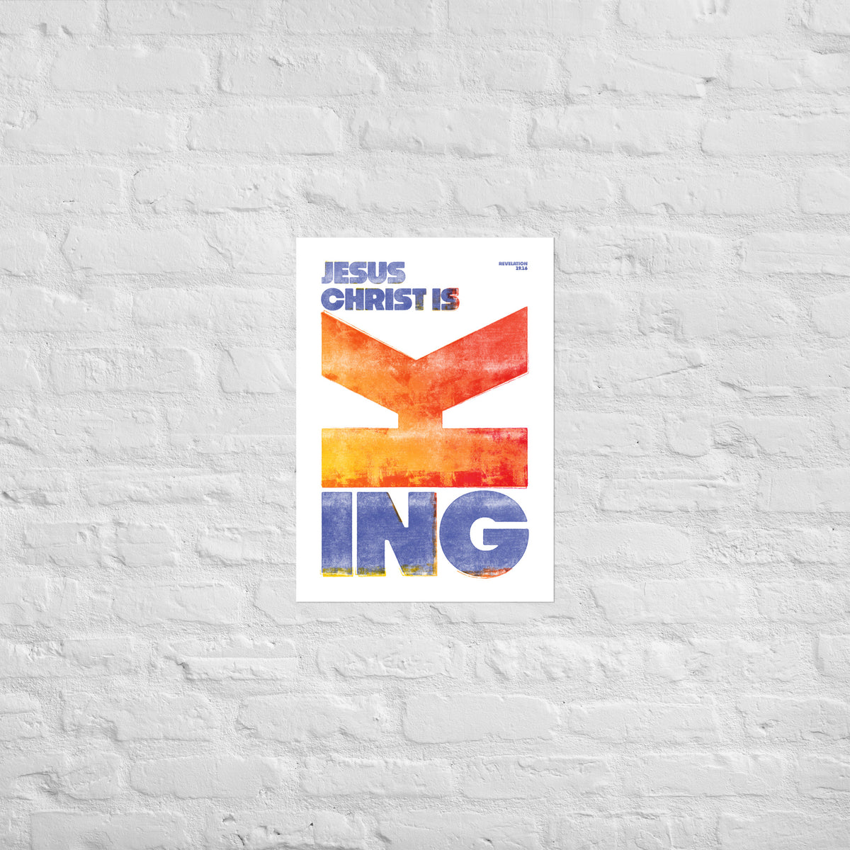 Revelation 19:16 print mounted directly on a white brick wall for a frameless, modern look.