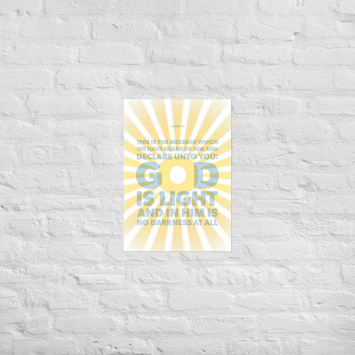 1 John 1:5 scripture print mounted directly on a white brick wall for a frameless, modern look.